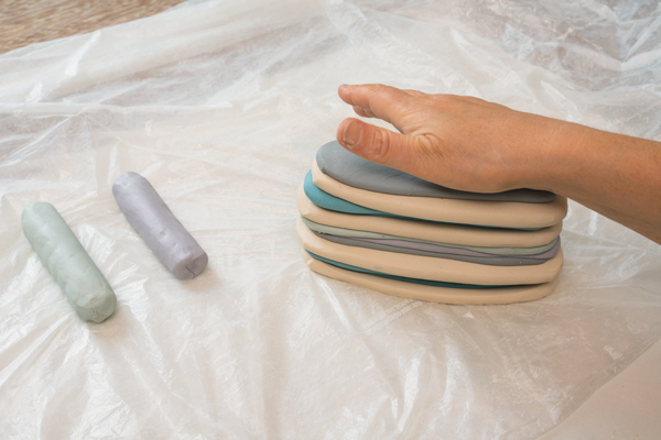 3 Flatten the coils with a rolling pin and stack them up, patting them down each time to stick them together.