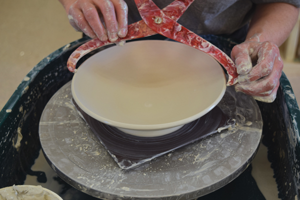 4 Throw the lid upside-down, making a wide, shallow bowl. Check the diameter of the lid with the calipers.