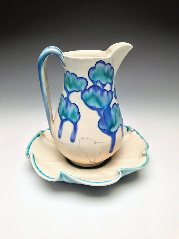 11 Small pitcher on saucer from the Searching for Skyline series, porcelain, blue slip inlay, soda fired to cone 6, 2011.