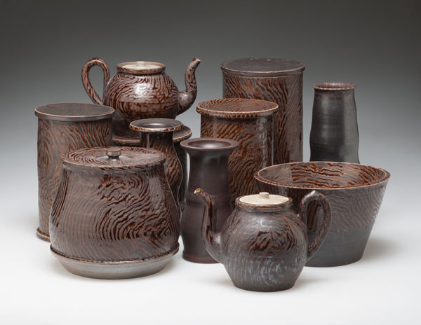 6 Crockery group, to 28 in. (71 cm) in height, stoneware, porcelain, polychrome glaze (faux-wood pattern), wood/oil/salt fired, 2012–14. Photo: Brian Oglesbee.