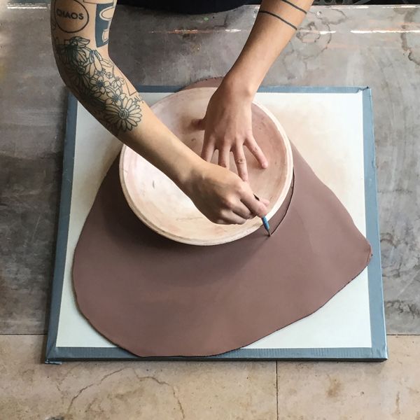 2 Trace and cut the slab to fit a bowl-shaped slump mold.