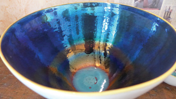 1 The fired metallic surface on the interior of bowl.