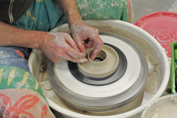 8 Throw a glaze catcher to fit each pot. Each catcher should have a pooling area for excess glaze and a riser.