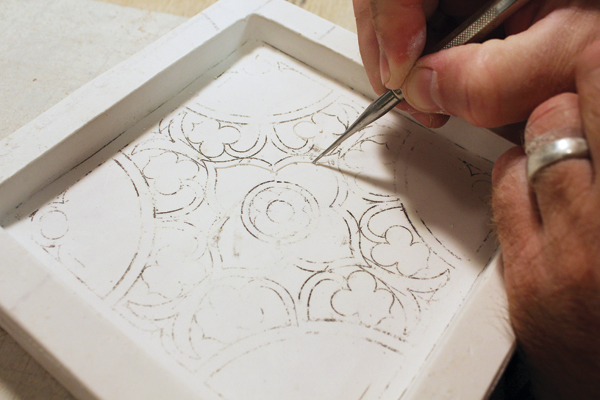 6 Carve the tile with plastic templates and dental tools after the plaster has set but before it completely dries out.