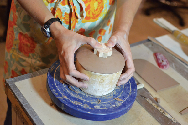 7 Press the bisque-fired positive into the mold to compress and refine the interior shape