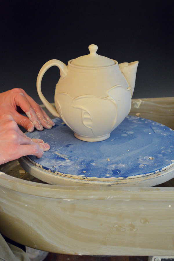 5 Allow the pot to dry for about an hour, or until the thicker slip lines stiffen up, then flip it right-side up.