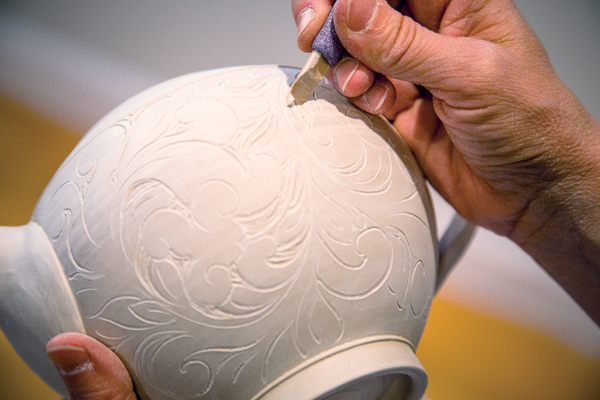 14 I use a handmade bamboo tool to carve into the negative space, creating depth and areas for the glaze to pool.