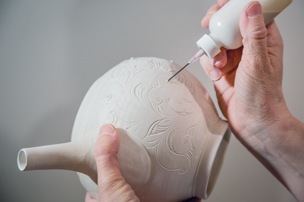 4 Apply a dot of Grolleg porcelain slip (made from the same clay body) with a slip-trailing bottle.