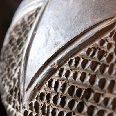 Detail of a traditional Zulu beer pot showing raised texture.