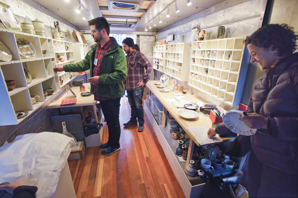 2 Adero Willard (foreground) inside the POW! truck along with NCECA attendees. Photos: Mara Lavitt.