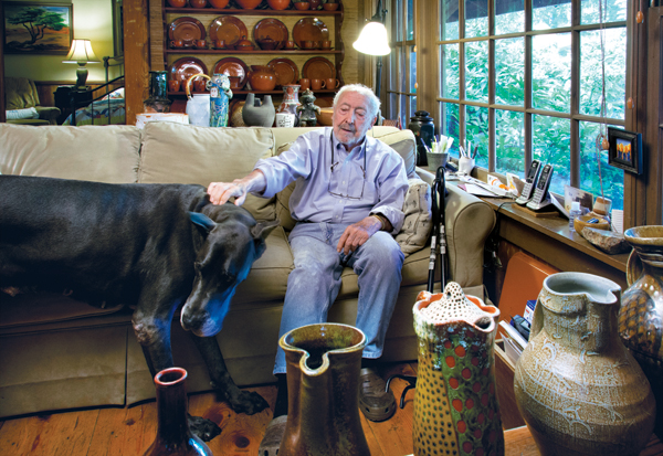 Dwight Holland sitting in his living room. Photo: Greg Stewart Photography.