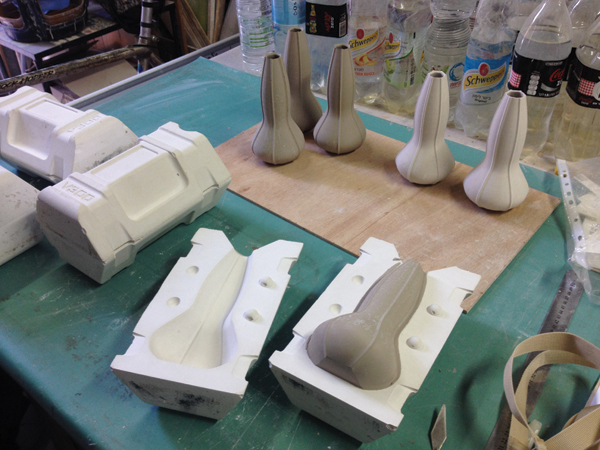 Demolded greenware vases on a ware board shown with a freshly opened mold in the foreground. Photos: Moti Fishbain.
