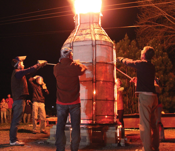 Preparing to open the petal kiln for the performance reveal of Sergei Isupov’s work.