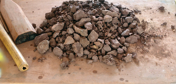 Processing raw Qinzhou clay used to make Nixing pottery.