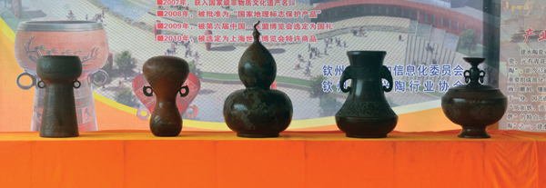 A row of Nixing pots on display during the re-opening celebration for the dragon kiln.