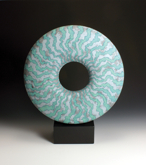 Gray-green disk on a slate base, 19 in. (49 cm) in height, stoneware, glaze, wax resist, fired to cone 9.