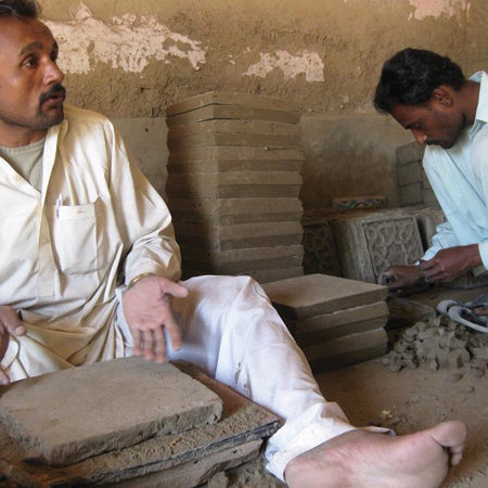 4 When the tiles are leather hard, they are cut into different square and geometric shapes. Some of the tiles are made flat and then engraved and some, like the high-relief, three-dimensional forms, are made in a mold.