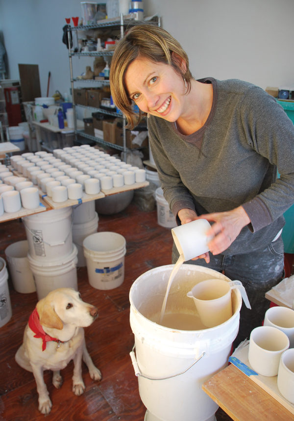 2 Sarah Kaye and Shelby the dog working in the studio. Photo: Kelly Ballantyne.