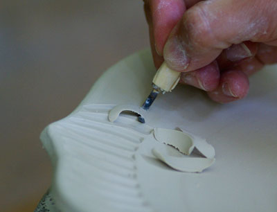 The clay carving tool in action.