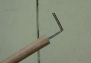 Detail of Emily's L-shaped clay carving tool.