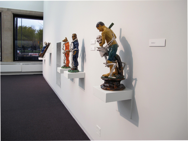 6 Installation view of south wall, including from right to left, The Execution, Dog Head Chains, Party in Chains, and Majolica Man.