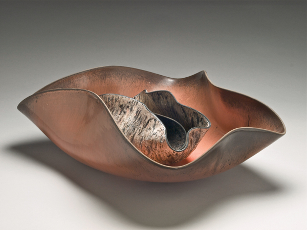 1 Untitled from Nesting Vessels series, 13 in. (33 cm) in length, wheel-thrown, low-fire, black basaltic clay, gloss and crater glazes, fired to cone 012, 2010.