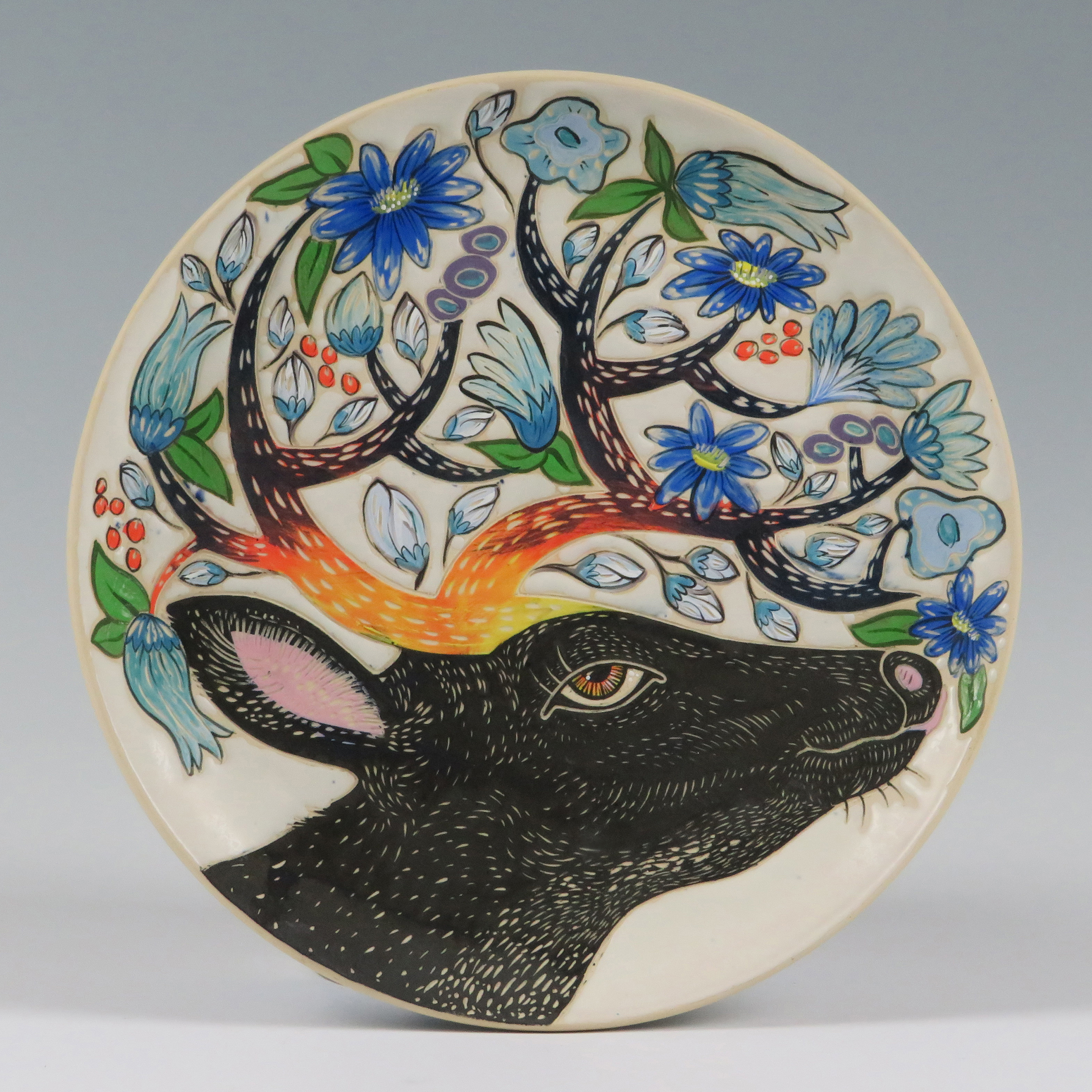 Jennifer Rosseter’s Foraging in the flower Garden, 10 in. (25 cm) in diameter, stoneware, wheel thrown, hand painted, sgraffito carved, underglaze, glaze, fired to cone 6, liquid quartz finish, 2020.