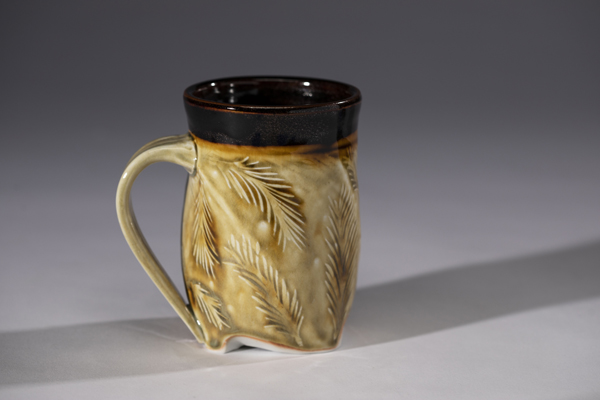 Bev Zerbib-Berda: California Redwood Twisted Mug, 5 in. (13 cm) in height, porcelain ash and tenmoku glaze, fired to cone 10 in reduction, 2022.