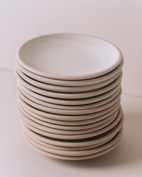 6 Stack of Riverbed Lunch Plates, 8 in. (20 cm) in diameter, cone-10 stoneware, reduction fired, 2021. Photo: Kyle Johnson.